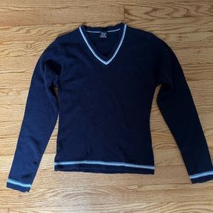 blue sweater, light blue and white trim